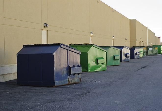 a row of construction dumpsters parked on a jobsite in Jacksonville